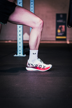 Athlete competing in a HYROX simulation