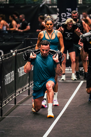 Athlete competing in a HYROX simulation