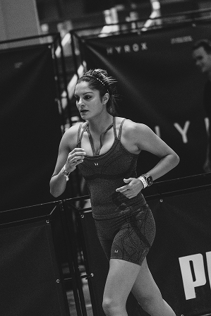 Athlete competing in a HYROX simulation
